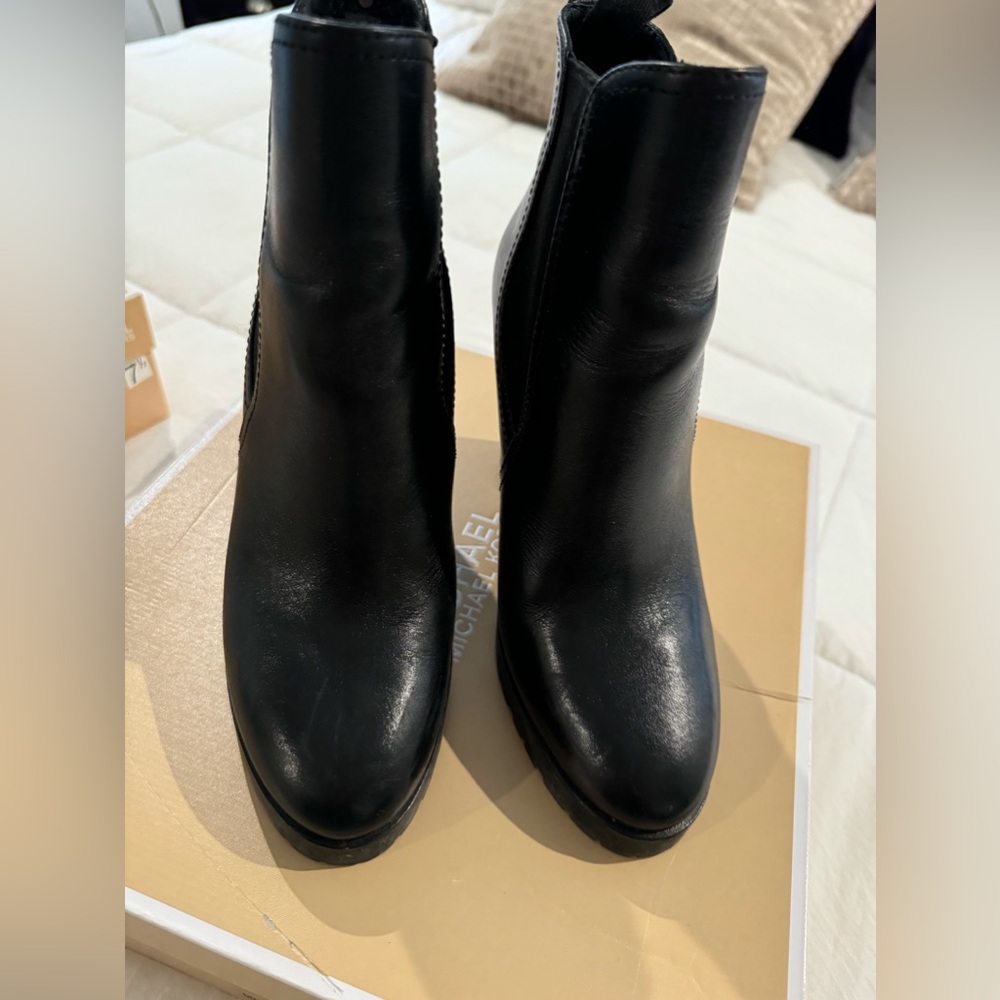 Authentic Michael Kors black wedge boots.